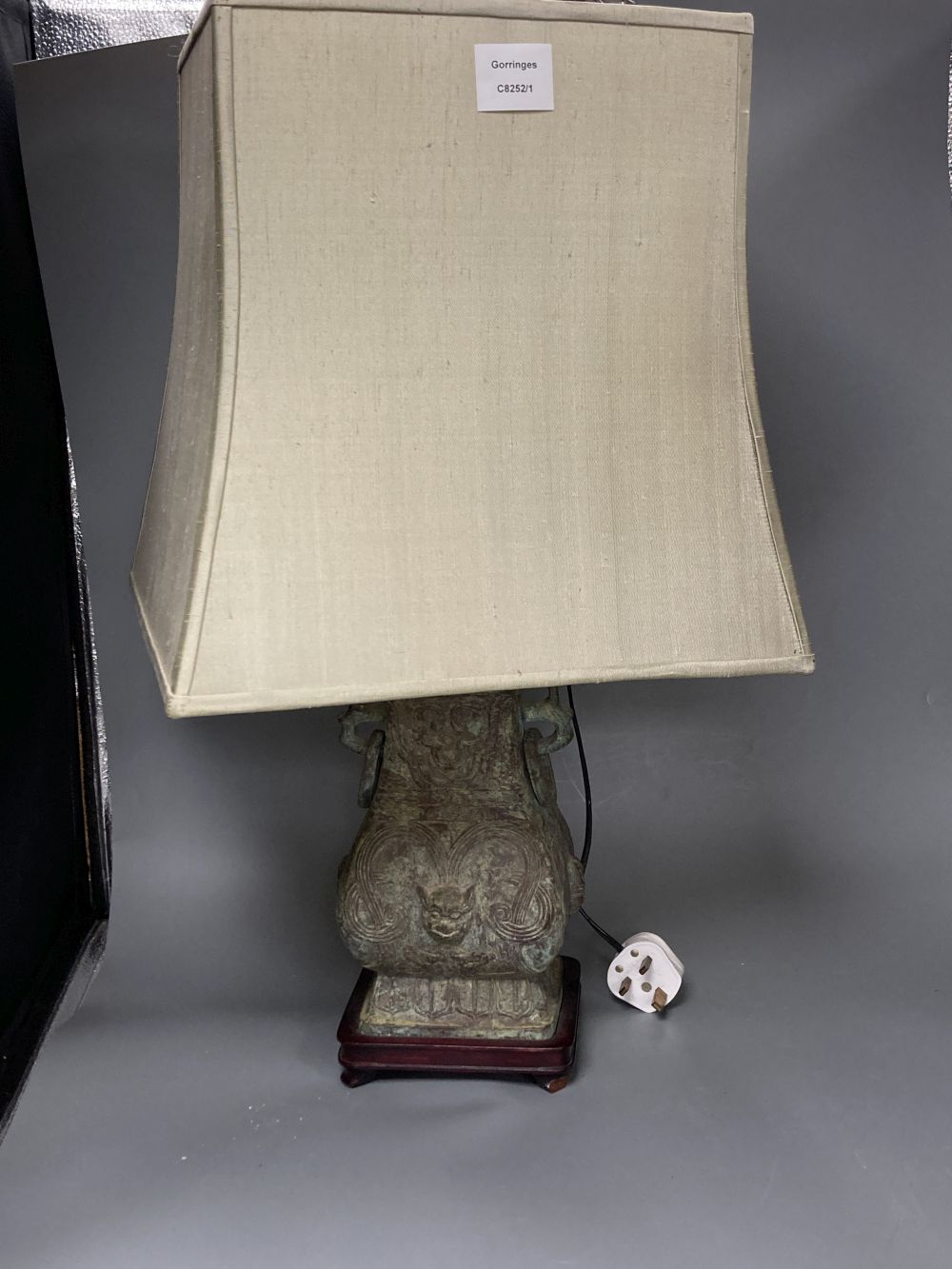 A pair of Chinese bronze lamp bases, in Zhou dynasty style, 36cm high excluding light fittings